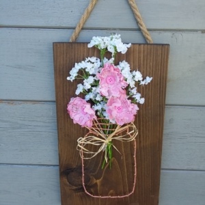 pot de fleurs string art sur cadre en bois teinté foncé